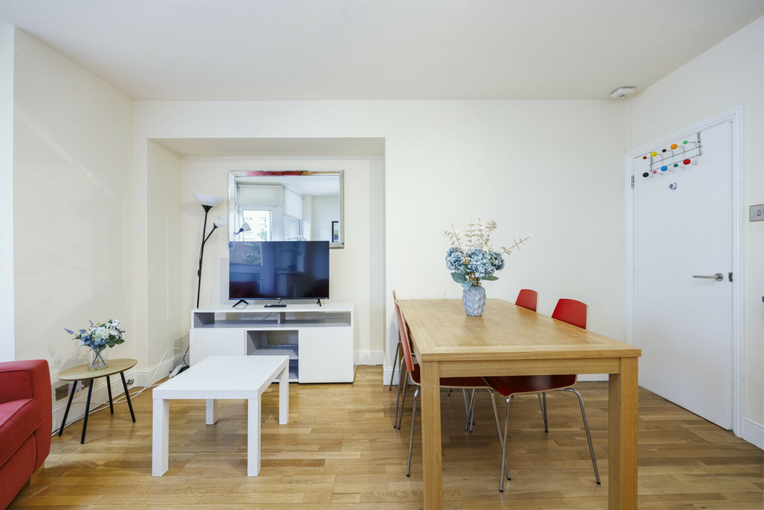 Compact dining table that comfortably accommodates four people, perfect for cozy gatherings and small dining spaces