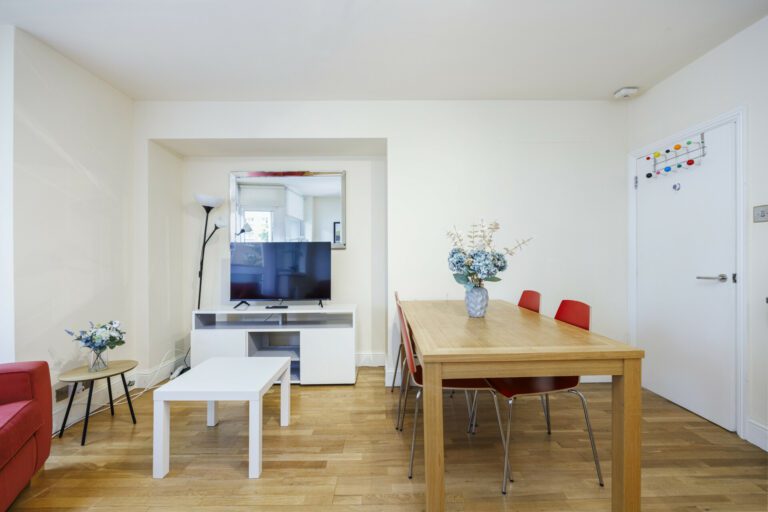 Compact dining table that comfortably accommodates four people, perfect for cozy gatherings and small dining spaces